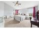Bright bedroom features a ceiling fan, blue accent, and an area for a desk at 170 Straughn Ln, Westfield, IN 46074