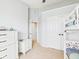 Neat and well-organized bedroom that has a bunk bed next to a set of drawers and leads to an adjacent hallway at 170 Straughn Ln, Westfield, IN 46074