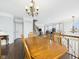 Open dining room with beautiful wooden table and chairs, and natural light at 170 Straughn Ln, Westfield, IN 46074