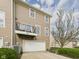 Back exterior of the home, featuring a second story balcony and two car garage at 170 Straughn Ln, Westfield, IN 46074