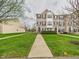 Desirable townhomes feature manicured lawns and inviting walkways at 170 Straughn Ln, Westfield, IN 46074