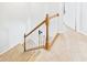 Carpeted staircase with white railings leads to the next level of the home at 170 Straughn Ln, Westfield, IN 46074