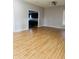 Bright and airy living room with hardwood floors and an open layout connecting to the kitchen at 1922 N Cherry St, Columbus, IN 47201