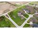 Birds-eye view of the property showcasing the manicured lawn, mature trees, and swimming pool at 20251 Dayspring Ct, Noblesville, IN 46062