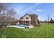 Expansive backyard featuring a well-maintained lawn, in-ground pool, and lovely two-story home at 20251 Dayspring Ct, Noblesville, IN 46062