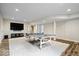 Finished basement with ping pong table, TV and recessed lighting for a fun recreational space at 20251 Dayspring Ct, Noblesville, IN 46062