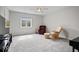 Bright bedroom featuring a ceiling fan, plush carpet, and comfortable seating near the window at 20251 Dayspring Ct, Noblesville, IN 46062
