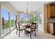 Bright dining area with sliding glass doors leading to the backyard and views of the landscape at 20251 Dayspring Ct, Noblesville, IN 46062