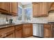 Cozy kitchen featuring stainless appliances, granite countertops, and wood cabinetry at 20251 Dayspring Ct, Noblesville, IN 46062