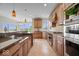 Gourmet kitchen featuring double ovens, granite countertops, and ample counter space at 20251 Dayspring Ct, Noblesville, IN 46062