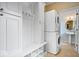 Convenient laundry room featuring stacked washer/dryer and adjacent sink at 20251 Dayspring Ct, Noblesville, IN 46062
