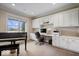 Bright office with a large window, built-in cabinets, and a piano at 20251 Dayspring Ct, Noblesville, IN 46062