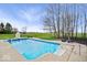 In-ground pool and lovely greenery creating a private backyard oasis for relaxation and recreation at 20251 Dayspring Ct, Noblesville, IN 46062