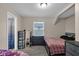 Cozy bedroom with natural light, neutral walls, and wood floors, creating a serene and inviting atmosphere at 2055 N Somerset Ave, Indianapolis, IN 46222