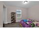 Bedroom displaying natural light, closet space, and wood floors, creating a practical and serene living space at 2055 N Somerset Ave, Indianapolis, IN 46222