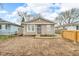Charming single-story home with light siding, updated windows, and a secure front entrance at 2055 N Somerset Ave, Indianapolis, IN 46222