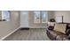 Bright living room featuring a front entry door, multiple windows and modern floors at 2055 N Somerset Ave, Indianapolis, IN 46222