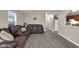 Comfortable living room featuring modern floors and a cozy seating area at 2055 N Somerset Ave, Indianapolis, IN 46222