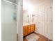 Well-lit bathroom with a double vanity, decorative mirror lighting, and separate shower and bathtub at 2416 Meadow Bend Dr, Columbus, IN 47201