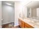 Bathroom with a double sink vanity, decorative lighting, and a separate bathtub and shower at 2416 Meadow Bend Dr, Columbus, IN 47201