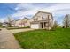 A traditional two-story home shows off its facade and nicely manicured front lawn at 2416 Meadow Bend Dr, Columbus, IN 47201