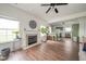 Open-concept living room with hardwood floors, a fireplace, and views of the kitchen at 2416 Meadow Bend Dr, Columbus, IN 47201