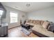 Comfortable living room area featuring a sectional sofa, coffee table, and wood-look flooring at 2416 Meadow Bend Dr, Columbus, IN 47201