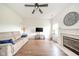 Bright living room with hardwood floors, a fireplace, and comfortable seating at 2416 Meadow Bend Dr, Columbus, IN 47201