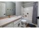 Well-lit bathroom with a modern vanity, updated fixtures, and a shower-tub combination at 2813 W Long Meadow Ln, Muncie, IN 47304