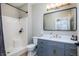Stylish bathroom features a framed mirror and vanity with storage, next to a toilet and walk-in shower at 2813 W Long Meadow Ln, Muncie, IN 47304