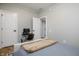 Cozy bedroom featuring neutral tones, a dedicated workspace, and a comfortable bed at 2813 W Long Meadow Ln, Muncie, IN 47304