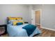 Cozy bedroom featuring a comfortable bed with decorative pillows, a serene atmosphere, and neutral paint tones at 2813 W Long Meadow Ln, Muncie, IN 47304