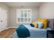 Inviting bedroom featuring a comfortable bed with accent pillows, bright window, and neutral décor that makes it serene at 2813 W Long Meadow Ln, Muncie, IN 47304