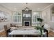 Cozy living room with fireplace, neutral tones, ample natural light, and stylish decor at 2813 W Long Meadow Ln, Muncie, IN 47304