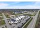 Drone eye view of a shopping center in a townhome community featuring easy access to retail shops and restaurants at 3240 Arabian Ln, Zionsville, IN 46077