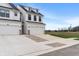 New construction home with white siding, black trim, driveway, and two car garage at 3240 Arabian Ln, Zionsville, IN 46077