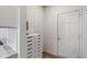Clean hallway features white cabinets for storage and a white door that leads to other spaces at 3240 Arabian Ln, Zionsville, IN 46077
