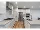 Bright, modern kitchen featuring stainless steel appliances and spacious countertops at 3240 Arabian Ln, Zionsville, IN 46077