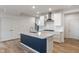 Modern kitchen boasts stainless steel appliances, subway tile backsplash, and a stylish black-accented island with a granite countertop at 3240 Arabian Ln, Zionsville, IN 46077