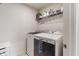 Bright laundry room with modern washer and dryer, complemented by stylish flooring at 3240 Arabian Ln, Zionsville, IN 46077