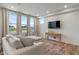 Cozy living room with neutral tones features large windows and plush seating, creating a relaxing atmosphere at 3240 Arabian Ln, Zionsville, IN 46077