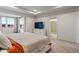 Bright and airy main bedroom featuring carpet, many windows, and tray ceiling at 3240 Arabian Ln, Zionsville, IN 46077