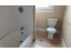 Bathroom with a tub and toilet at 3319 N Capitol Ave, Indianapolis, IN 46208