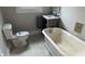 Bathroom with a classic clawfoot tub, vanity, and tile flooring at 3319 N Capitol Ave, Indianapolis, IN 46208