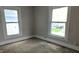 Cozy bedroom with neutral-colored walls and two windows providing natural light at 3319 N Capitol Ave, Indianapolis, IN 46208