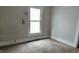 Standard bedroom featuring carpet flooring, neutral wall color, and a window at 3319 N Capitol Ave, Indianapolis, IN 46208