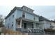 Charming two-story home with a covered front porch and light blue siding at 3319 N Capitol Ave, Indianapolis, IN 46208