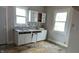 View of the kitchen with white cabinets, a tiled backsplash, and ample counter space at 3319 N Capitol Ave, Indianapolis, IN 46208