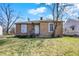Charming single story home with brick veneer and a yard with mature trees at 3343 N Drexel Ave, Indianapolis, IN 46218