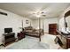 Bedroom featuring a four-poster bed, hardwood furniture, and a ceiling fan at 3360 E Main St, Danville, IN 46122